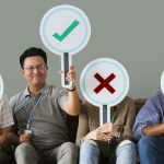 Group of people holding true & false icons